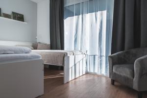 Postel nebo postele na pokoji v ubytování Nádas Apartman
