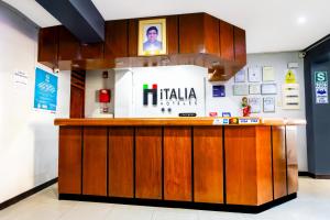 a bar in a store with avertisement for at Hotel Italia II in Chiclayo