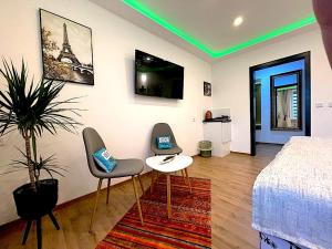 TV a/nebo společenská místnost v ubytování Hotel Uthoff