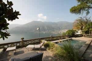 a swimming pool with a view of the water at Villa Intreccio in Blevio