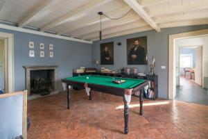 a living room with a pool table in it at Villa Intreccio in Blevio