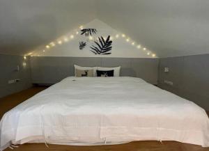 A bed or beds in a room at After the Court Chiaohsi