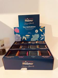 a box of nineiner chocolates on a table at Romantisches wohnen in Worms