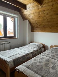 Postel nebo postele na pokoji v ubytování Prika Žika