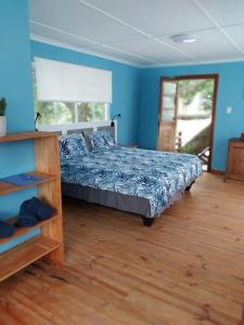 Llit o llits en una habitació de Bushmansriver Tree-House