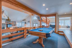 a pool table in a room with a staircase at Red Cedar - Unit 30 in Sunriver