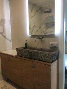 a bathroom with a sink with a faucet at Agriturismo Voeuja Lago Maggiore in Luino