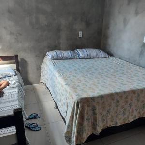 Łóżko lub łóżka w pokoju w obiekcie Casa Jardim