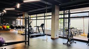 a gym with exercise equipment and a large window at Bed and Breakfast Hotel Cruzmorph in Bogotá