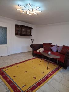 a living room with a couch and a table at Ferienhaus in Burgenlandkreis (Osterfeld) in Osterfeld