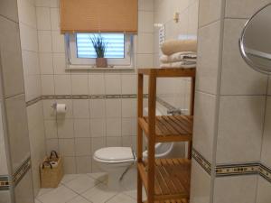 a small bathroom with a toilet and a window at Villa Skoric in Orebić +64 photos
