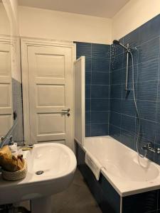 a bathroom with a sink and a tub and a toilet at DIMA'S HOUSE in Volla