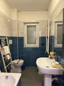 a bathroom with a sink and a toilet at DIMA'S HOUSE in Volla