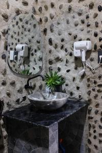 a bathroom with a sink and a mirror at Gạo Homestay in Mui Ne