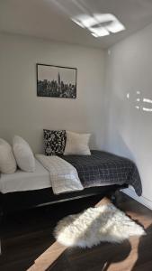 a bedroom with a bed with a blanket and a rug at Luxury 3-Beds Apartment in Yorkville with the Best City View in Downtown Toronto in Toronto +35 photos