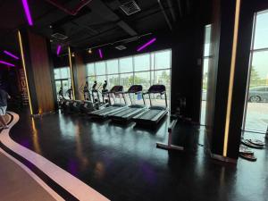 a gym with rows of empty chairs in a room at Studio apartment in Jumeriah village triangle in Dubai