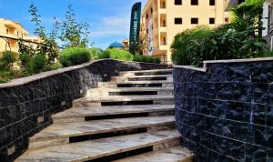 a set of stairs in a retaining wall at Jasmine Inn Deluxe in Badr