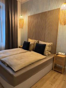 a bedroom with a large bed in a room at H-36 RESIDENCE - BRIGHT Collection in Koblenz
