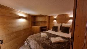 Łóżko lub łóżka w pokoju w obiekcie Val Thorens - SILVERALP - Duplex avec 3 chambres