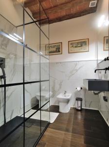 a bathroom with a toilet and a sink at Eulalia's House in Modena