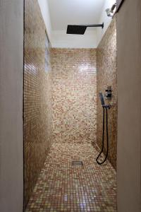 a bathroom with a shower with a phone in it at Eulalia's House in Modena