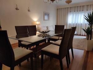 a dining room with a table and chairs at Ocean View in Vila do Conde