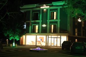 a building at night with a fountain in front of it at Green Roof Boutique Hotel & Spa in Terkos