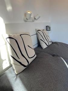 two pillows on a bed in a bedroom at Central Hideaway in Maria Alm am Steinernen Meer