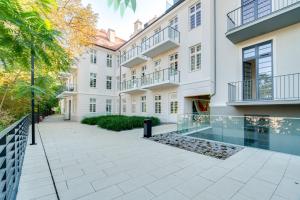 an exterior view of a building with a courtyard at Apartament Riverside View in Wrocław