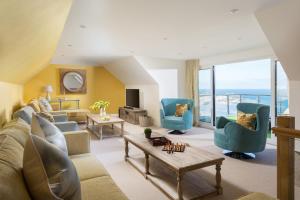 a living room with a couch and chairs at Scots Craig in St Ives