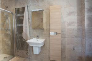 a bathroom with a sink and a shower at Scots Craig in St Ives
