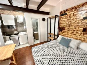 En eller flere senge i et værelse på Nuevos Apartamentos frente al mar y a la playa