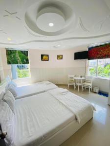 Giường trong phòng chung tại Song Xanh Hotel near SECC - FV