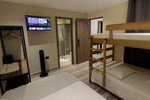 Postel nebo postele na pokoji v ubytování Casa Indigo Laureles-Estadio con Jacuzzi