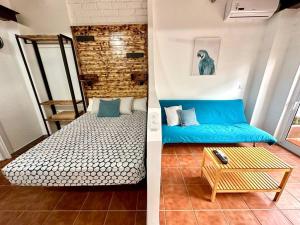 En eller flere senge i et værelse på Nuevos Apartamentos frente al mar y a la playa