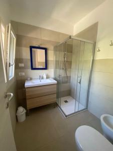 a bathroom with a shower and a sink and a toilet at MAISON ANZIO E ROSA in Ravenna +29 photos