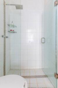 a shower with a glass door in a bathroom at Departamento Privado Centro Histórico Guadalajara. in Guadalajara