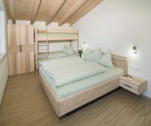 a bedroom with a bed and a bunk bed at Appartement Gertraud in Westendorf