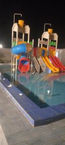 a swimming pool with at شاليهات ميرامار مكة الحسينية in Ash Shishah