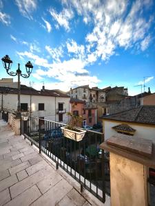 a balcony with a view of a city with buildings at La casa del Nonno in Altavilla Irpina