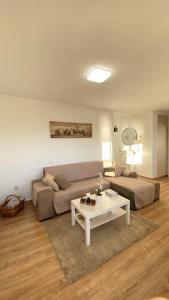 a living room with a couch and a table at BenalBeach Residential in Benalmádena