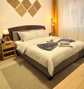 Ένα ή περισσότερα κρεβάτια σε δωμάτιο στο Tusmorez Central Apartment