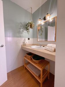 a bathroom with a sink and a mirror at Meloneras by the sea in San Bartolomé de Tirajana