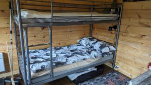 a room with two bunk beds in a room at Lapland Snow Moose in Vittangi Kapell