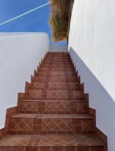a stairway with a brown brick stair case at Tortugas Bay, MX in Don Pancho +214 photos