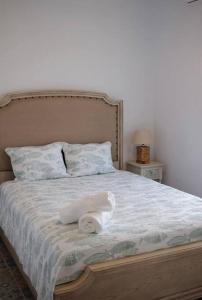 a bed with two towels on top of it at Tortugas Bay, MX in Don Pancho