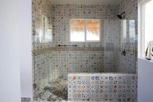 a bathroom with a shower with a tub at Tortugas Bay, MX in Don Pancho