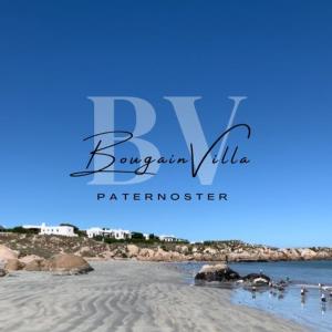 a picture of a beach with people in the water at Bougain Villa Studio 2 in Paternoster