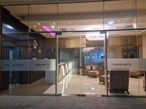 a glass door of a building with a lobby at Ocean Breeze Residence- Negombo in Negombo