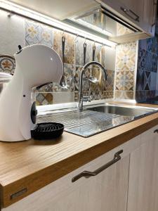 a kitchen with a mixer on a counter next to a sink at Ski paradise - Cielo alto Cervinia in Breuil-Cervinia